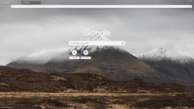 Grey clouds over snowy mountains